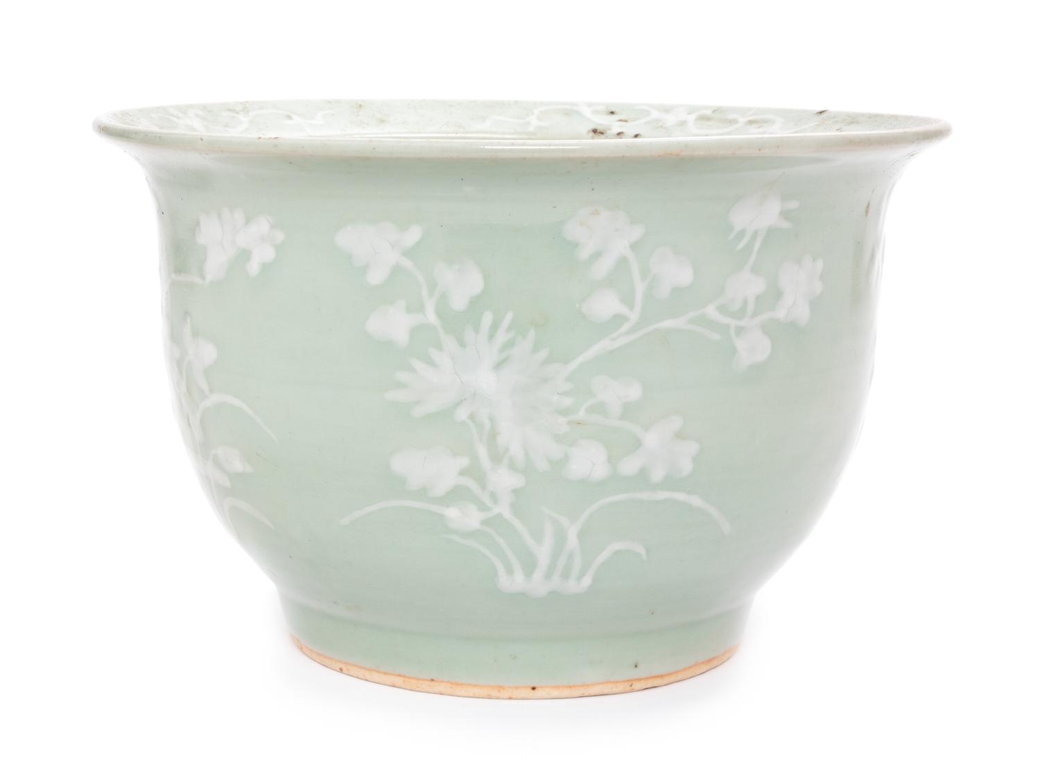 A Chinese White Slip Decorated Celadon Ground Cachepot Height 11 1/2 inches.