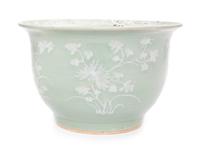 A Chinese White Slip Decorated Celadon Ground Cachepot Height 11 1/2 inches.