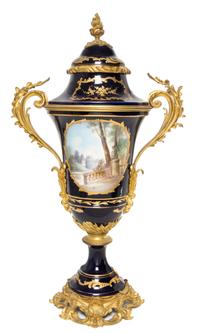 A Sevres Gilt Bronze Mounted Porcelain Urn Height 26 1/4 inches.