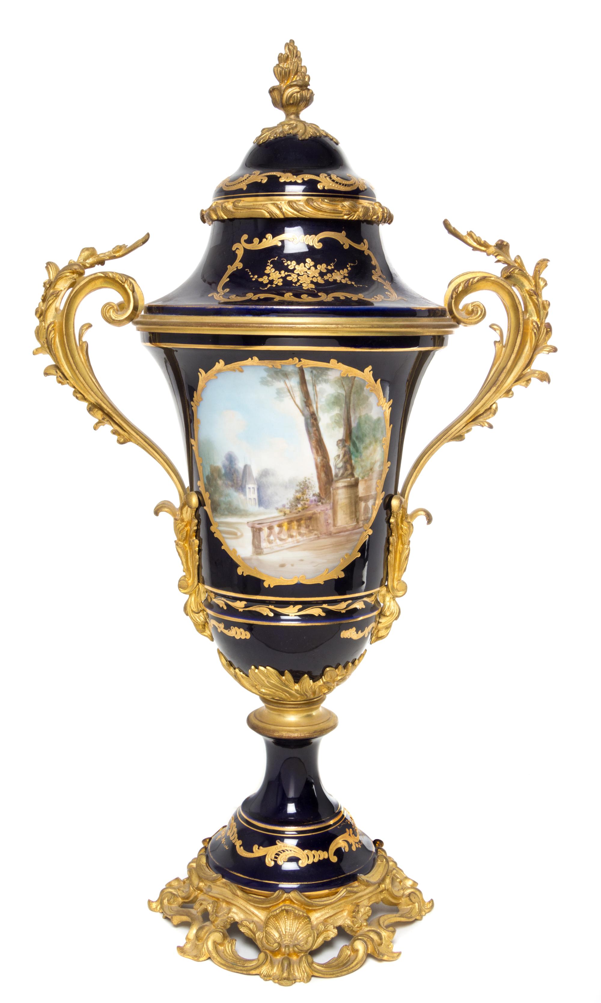 A Sevres Gilt Bronze Mounted Porcelain Urn Height 26 1/4 inches.