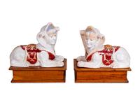 A Pair of Polychromed Ceramic Sphinxes — 20TH CENTURY