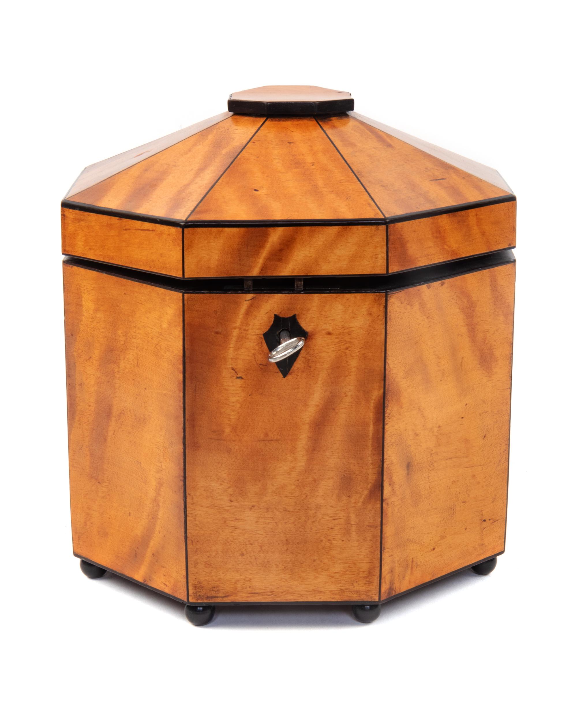 A Biedermeier Ebony Banded Satinwood Octagonal Tea Caddy