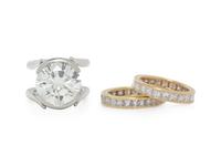 DIAMOND AND PLATINUM RING WITH PAIR OF ETERNITY BANDS