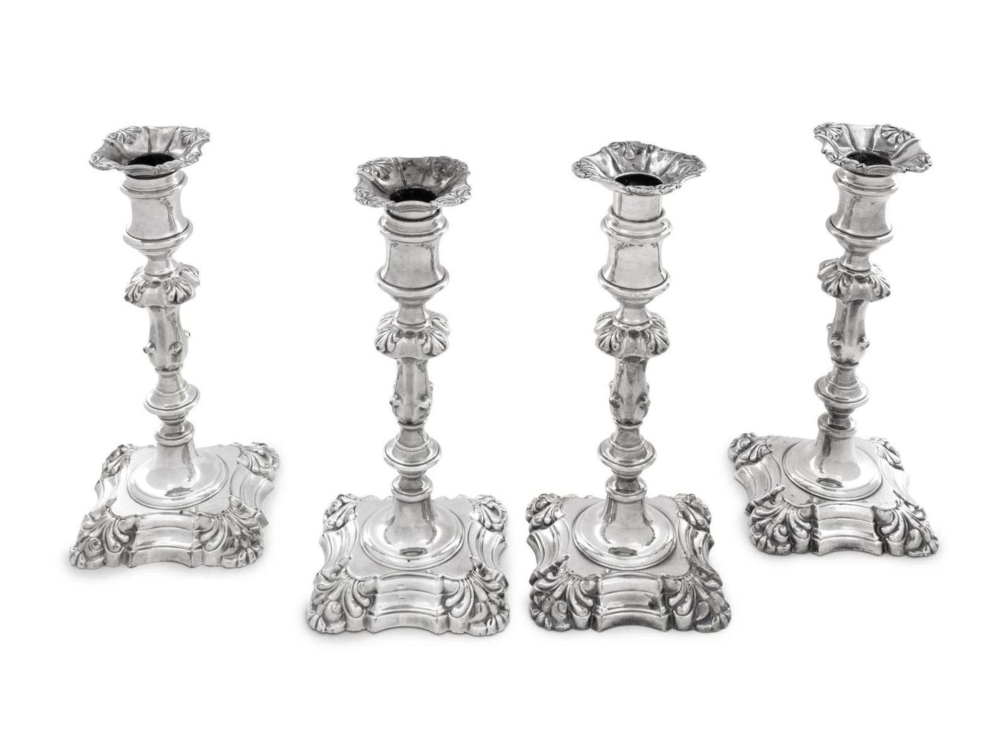 A Group of Four English Silver-Plate Candlesticks