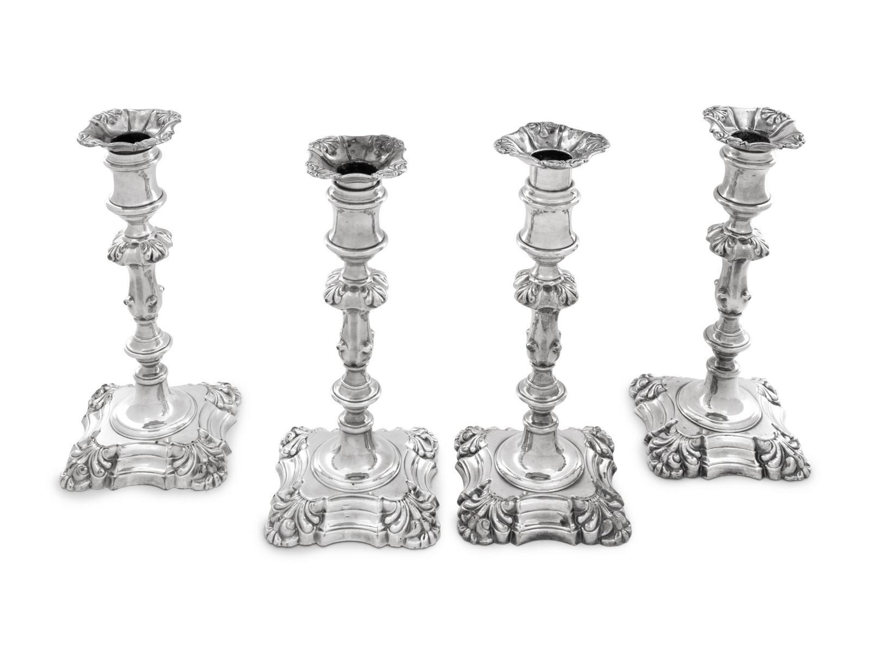 A Group of Four English Silver-Plate Candlesticks