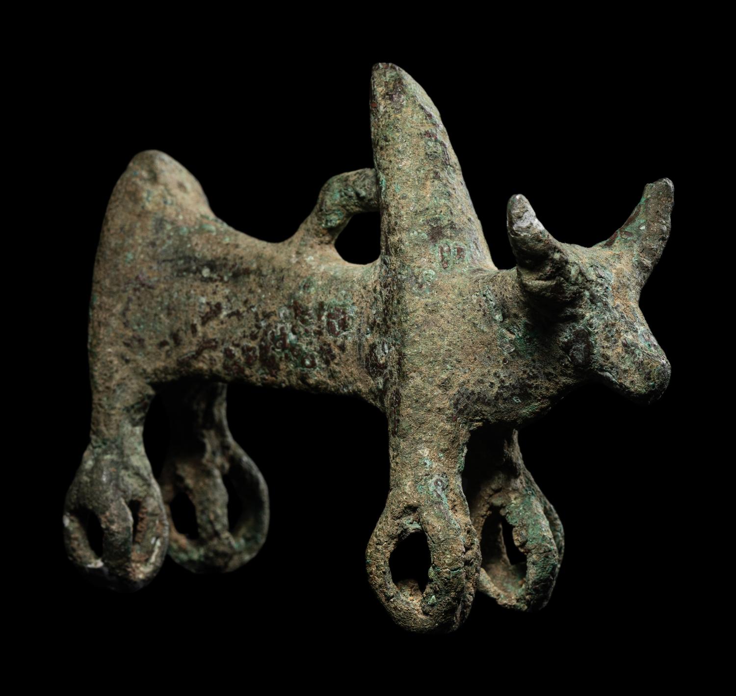 A Luristan Bronze Cow with Four Sphere Feet
