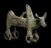 A Luristan Bronze Cow with Four Sphere Feet