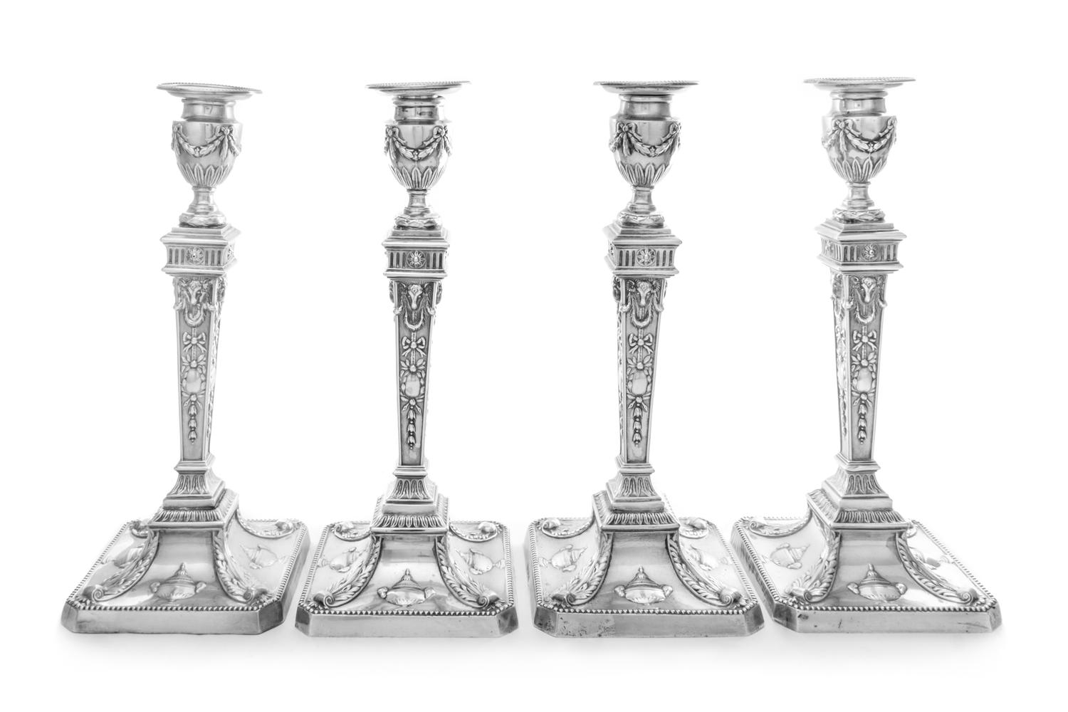 A Set of Four George V Silver Candlesticks, William Hutton and Sons, Sheffield, 1927, each having a ribbon and festoon decorated urn fo