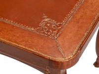 A French Provincial Fruitwood and Tooled Leather Writing Table