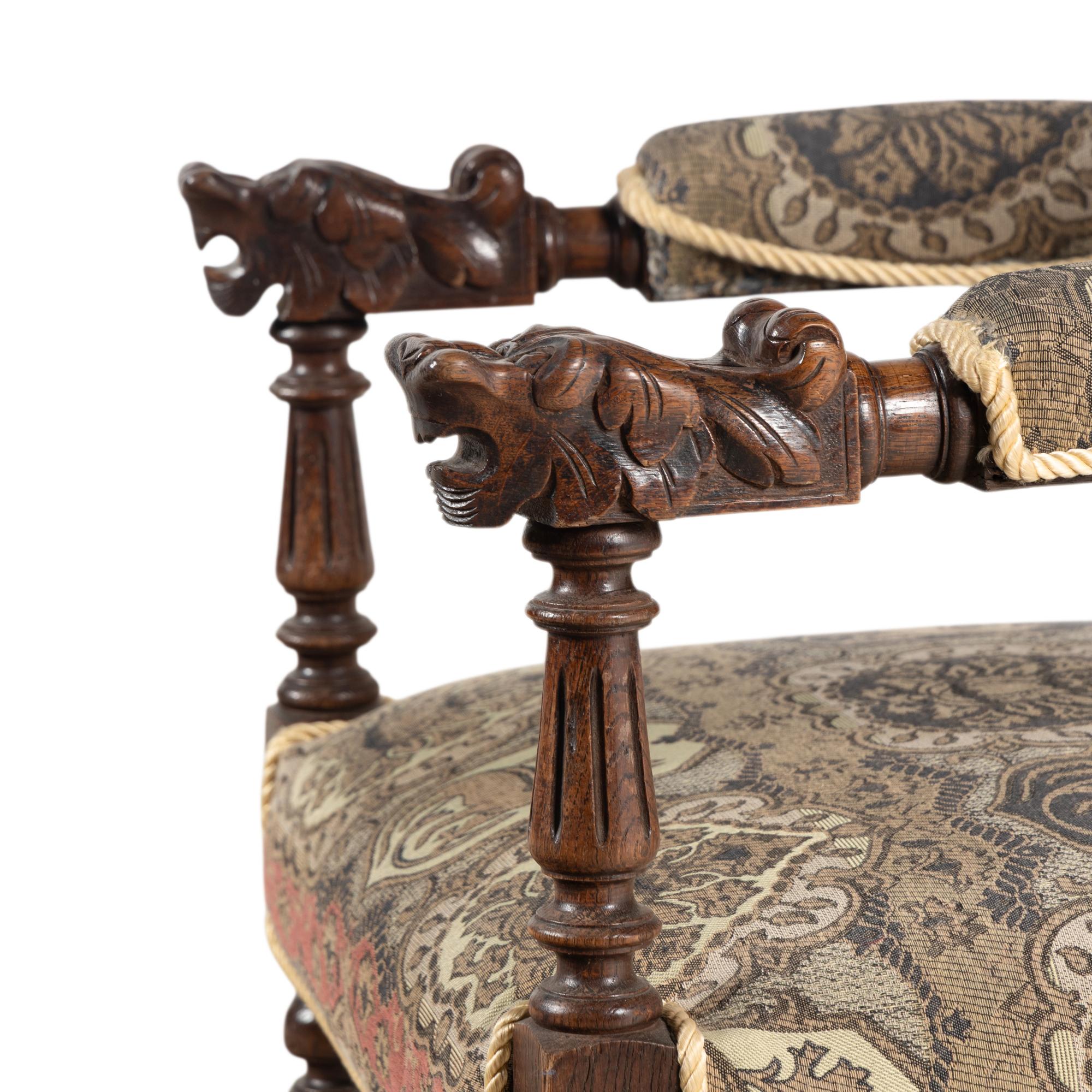 A Renaissance Revival Carved Oak Armchair