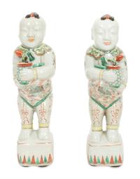 A Pair of Chinese Porcelain Figures of Boys