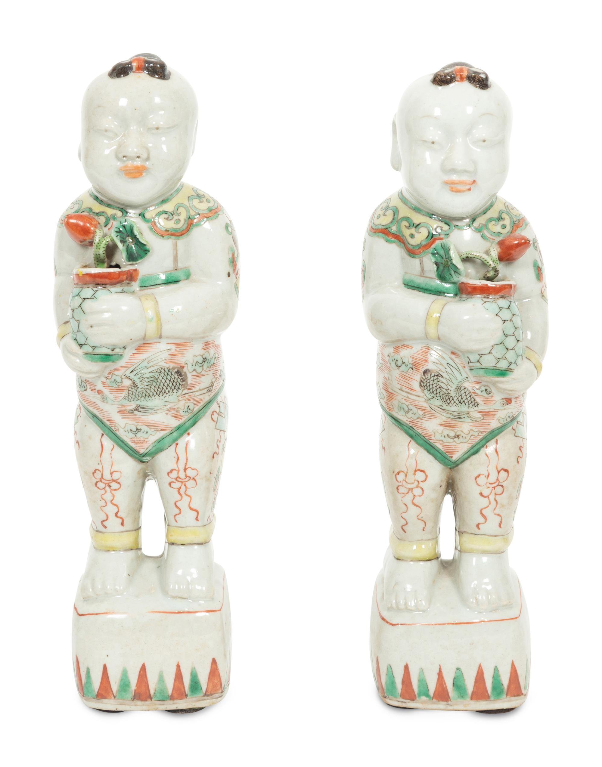 A Pair of Chinese Porcelain Figures of Boys