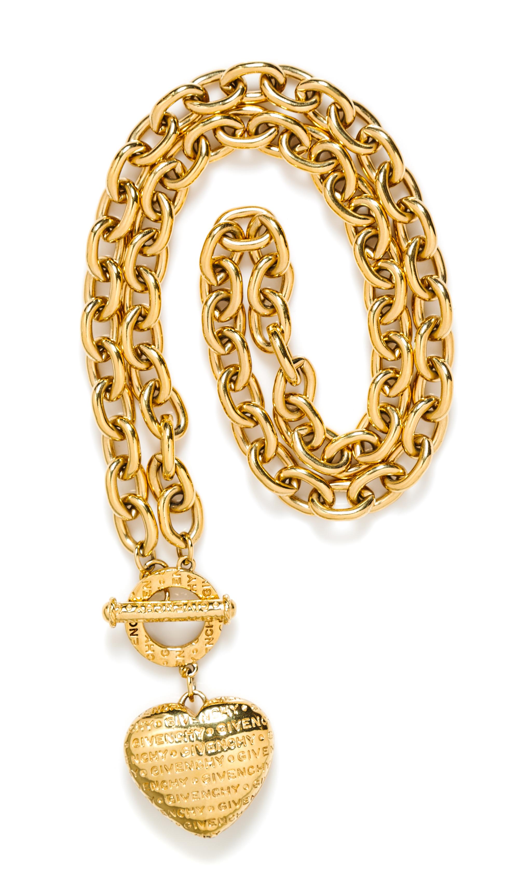 A Givenchy Goldtone Link Necklace with Heart Pendant, 30" length.