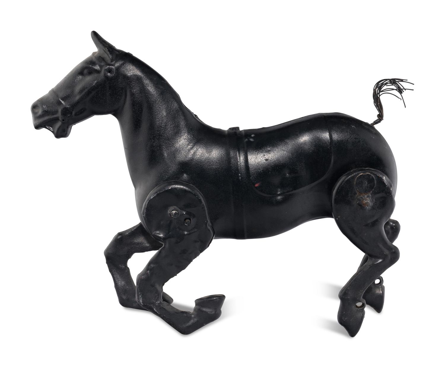 A Pressed Metal Horse Carousel Figure