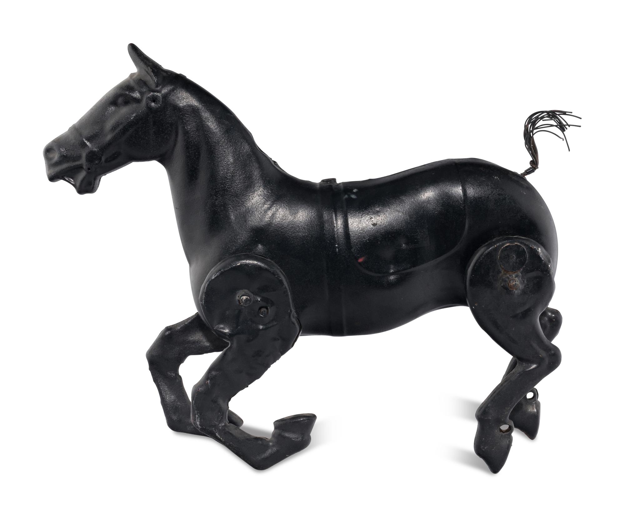 A Pressed Metal Horse Carousel Figure