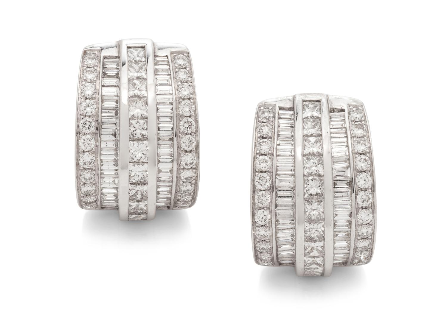 A Pair of 14 Karat White Gold and Diamond Earclips,