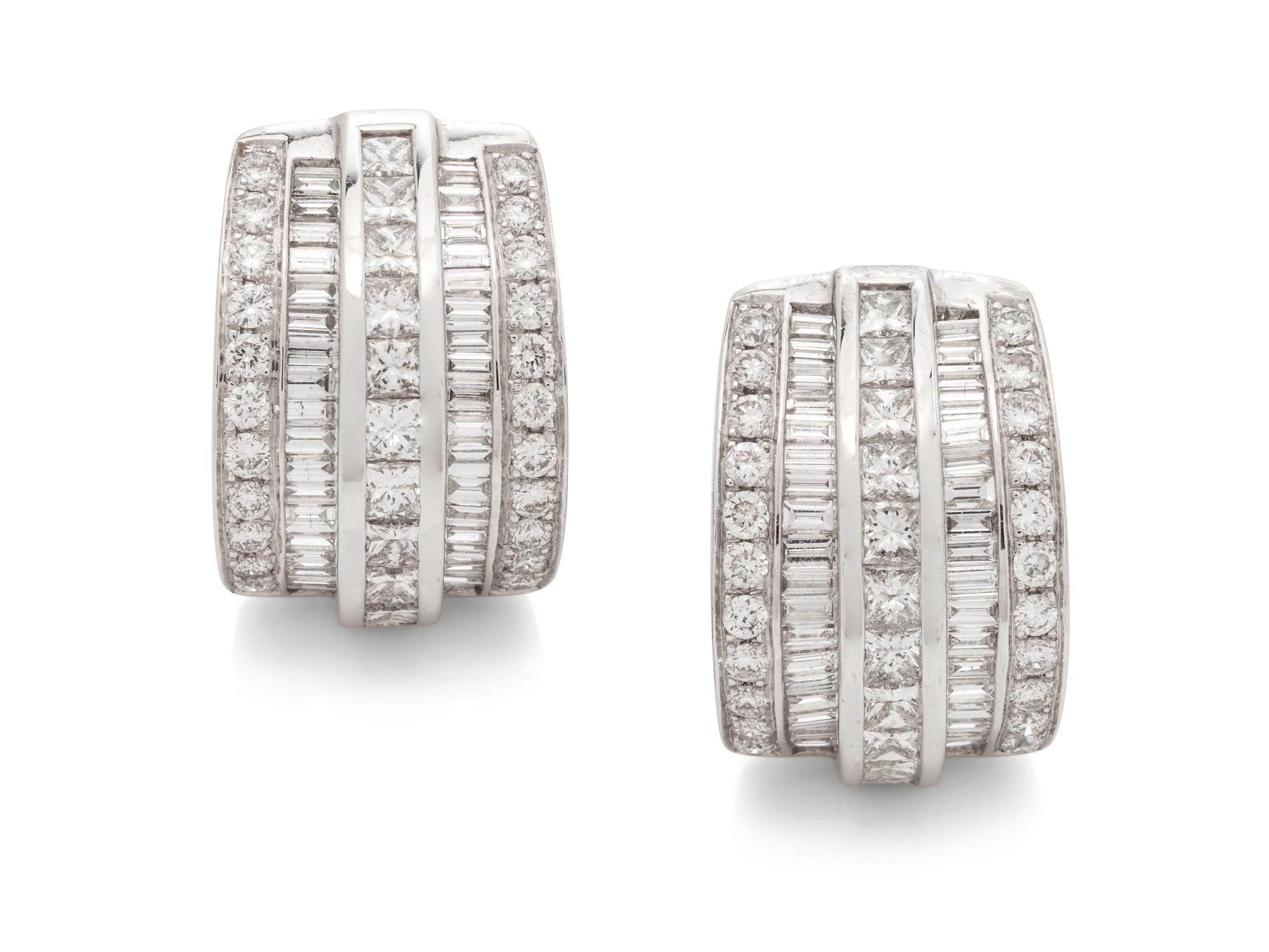 A Pair of 14 Karat White Gold and Diamond Earclips,