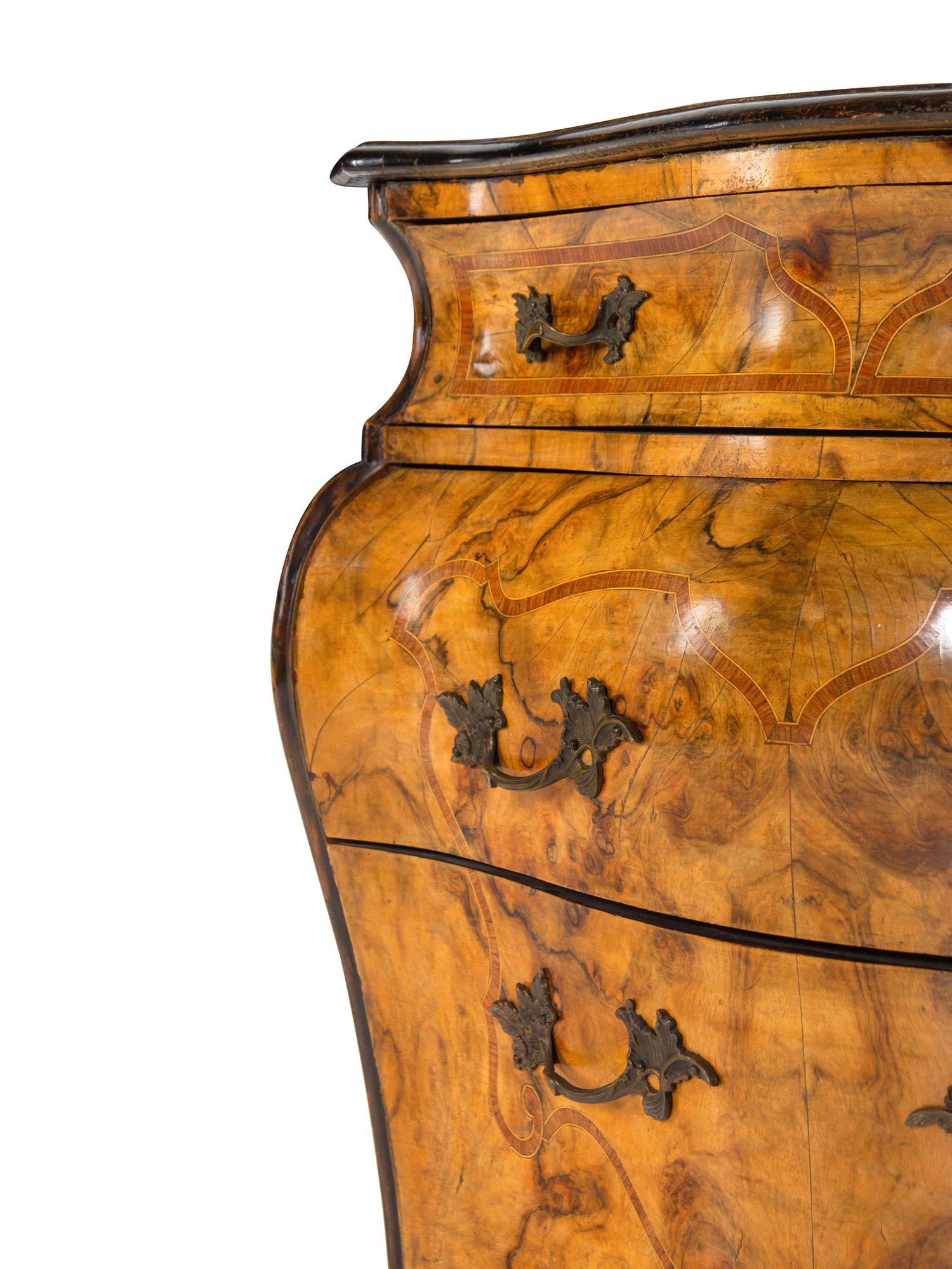 An Italian Rococo Satinwood Inlaid Burl Walnut Commode