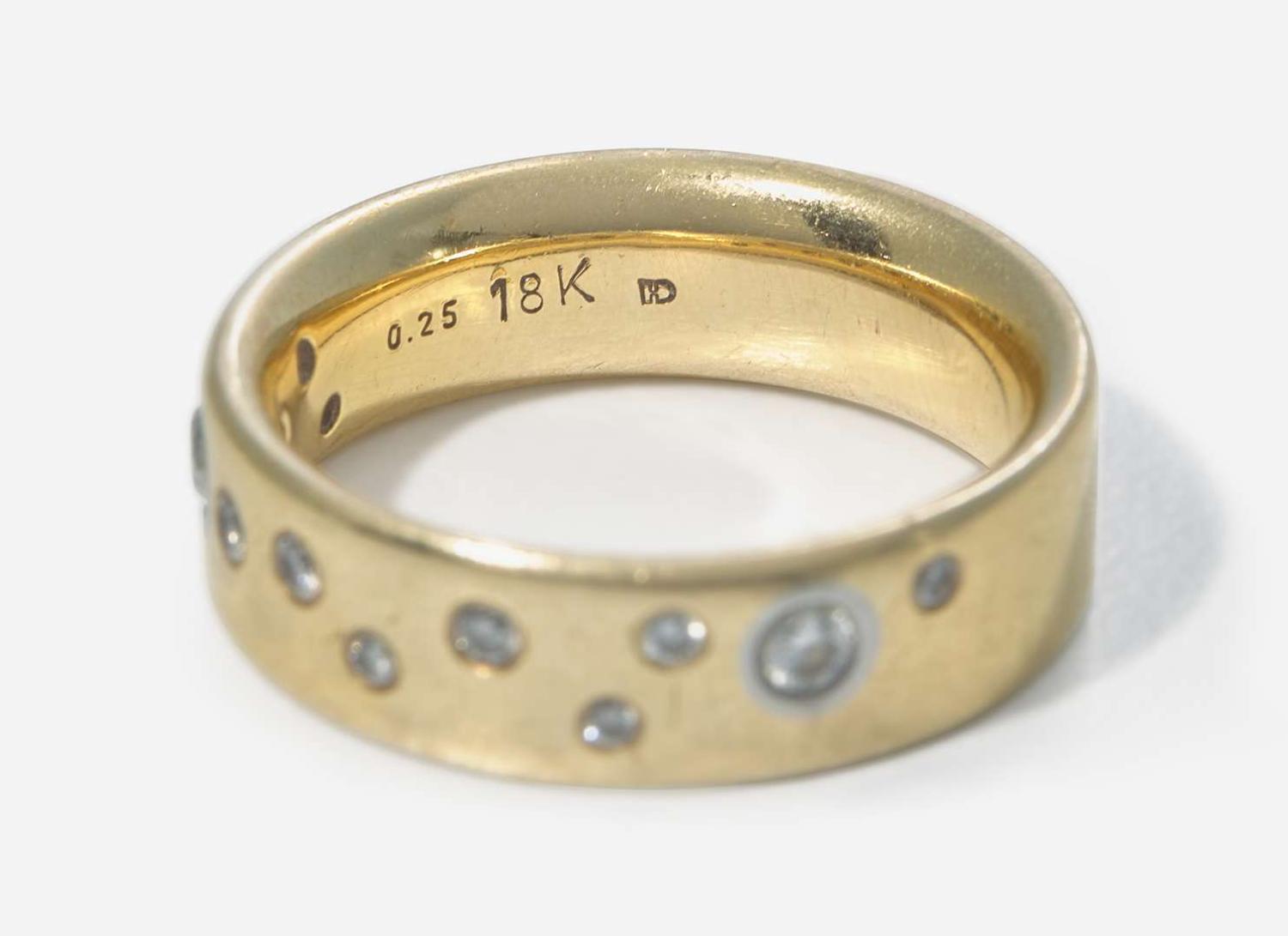 An 18K Yellow Gold Band with Accent Diamonds