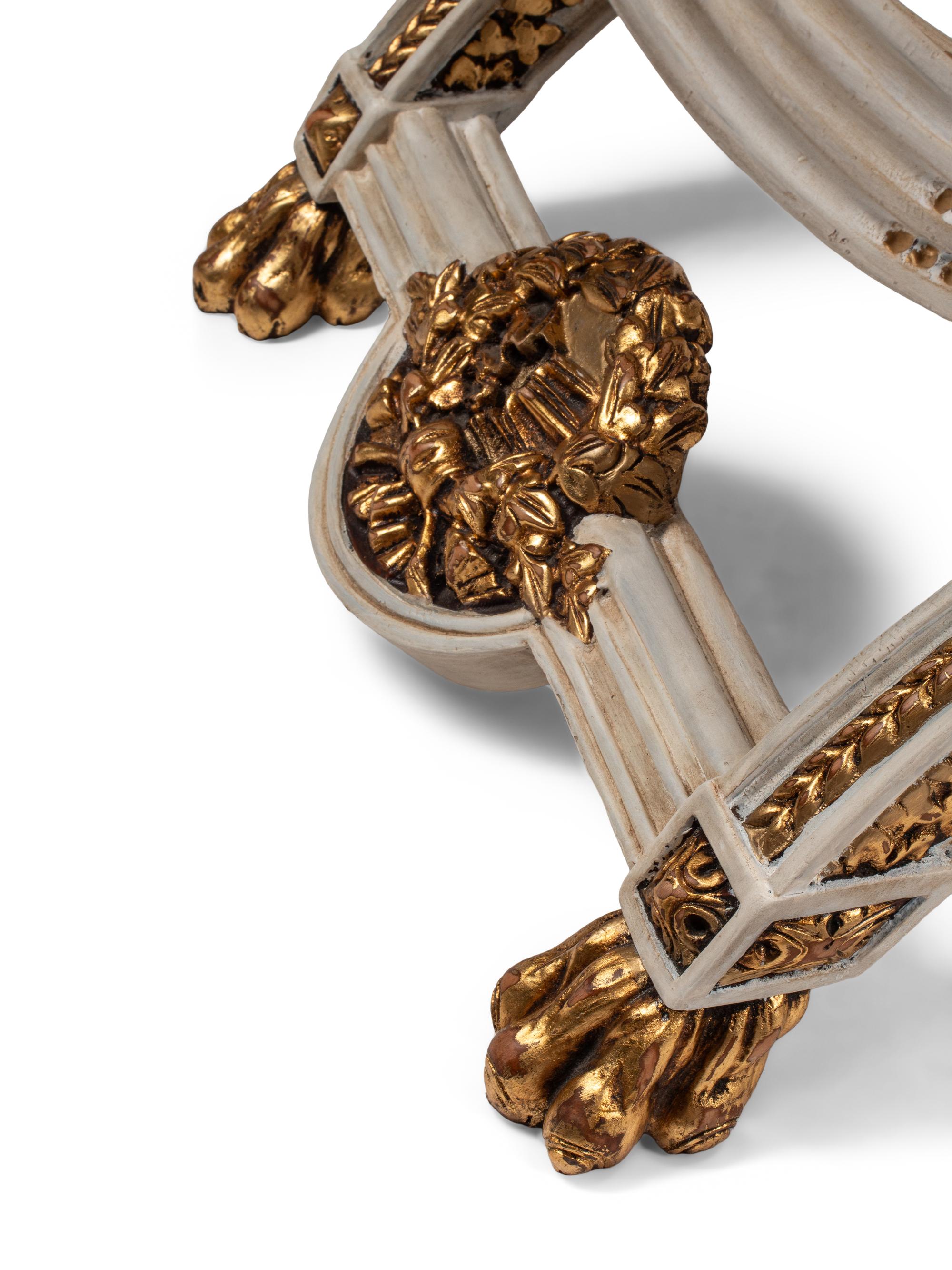 A Pair of Continental Painted and Parcel Gilt Curule-Form Tabourets