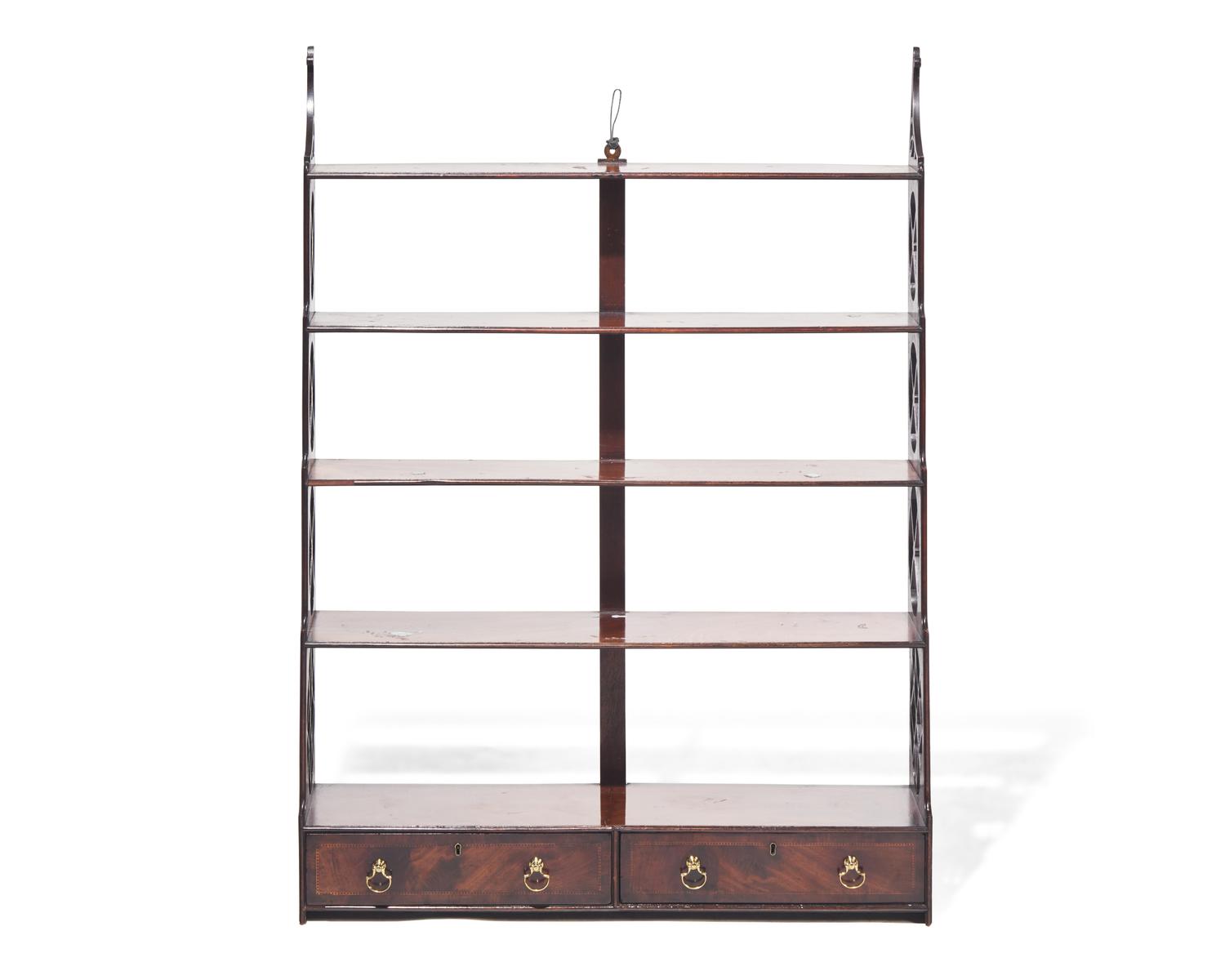 A George III fret-carved and inlaid mahogany hanging wall shelf, circa 1785