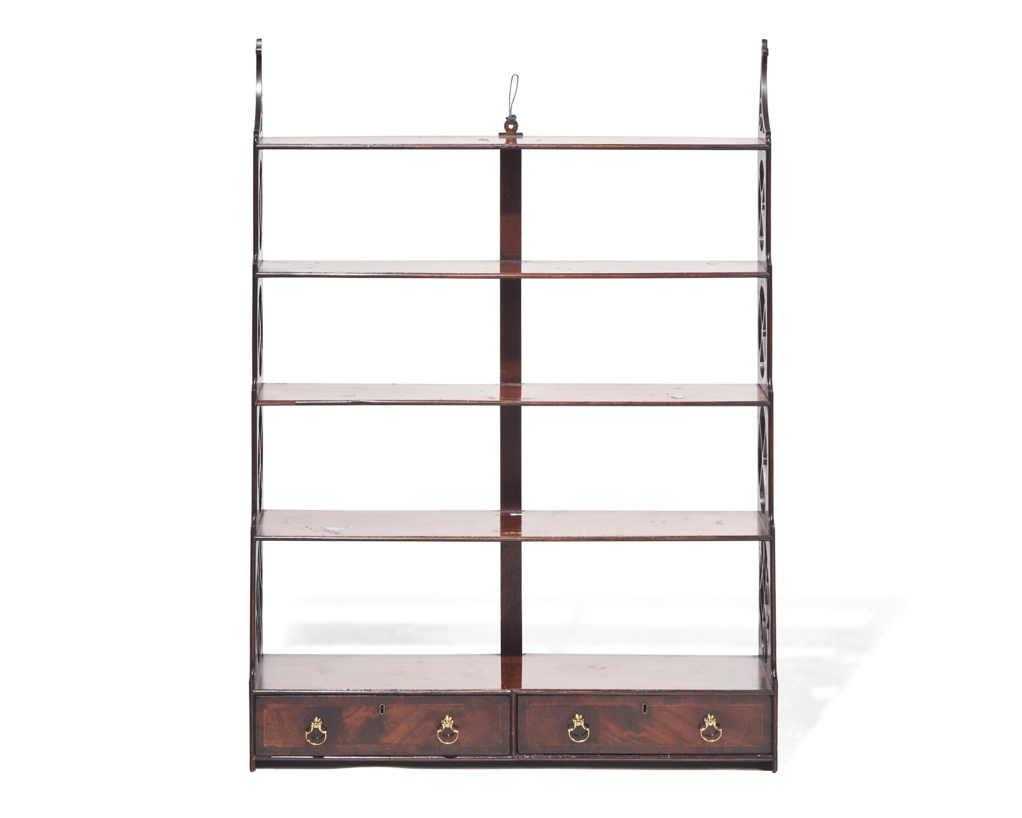 A George III fret-carved and inlaid mahogany hanging wall shelf, circa 1785