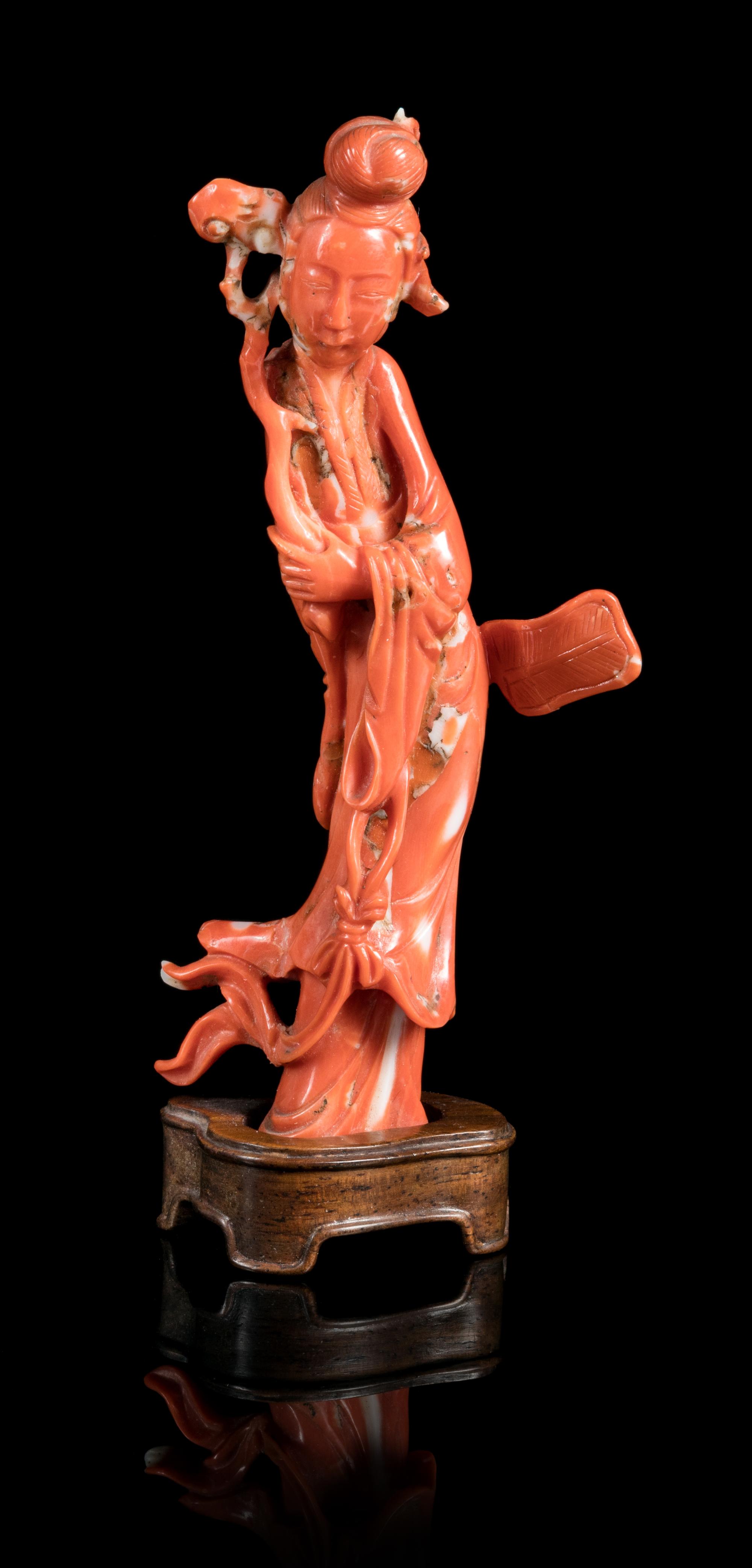 A Carved Red Coral Figure of a Lady Height 4 1/8 inches. — QING DYNASTY (1644-1912)