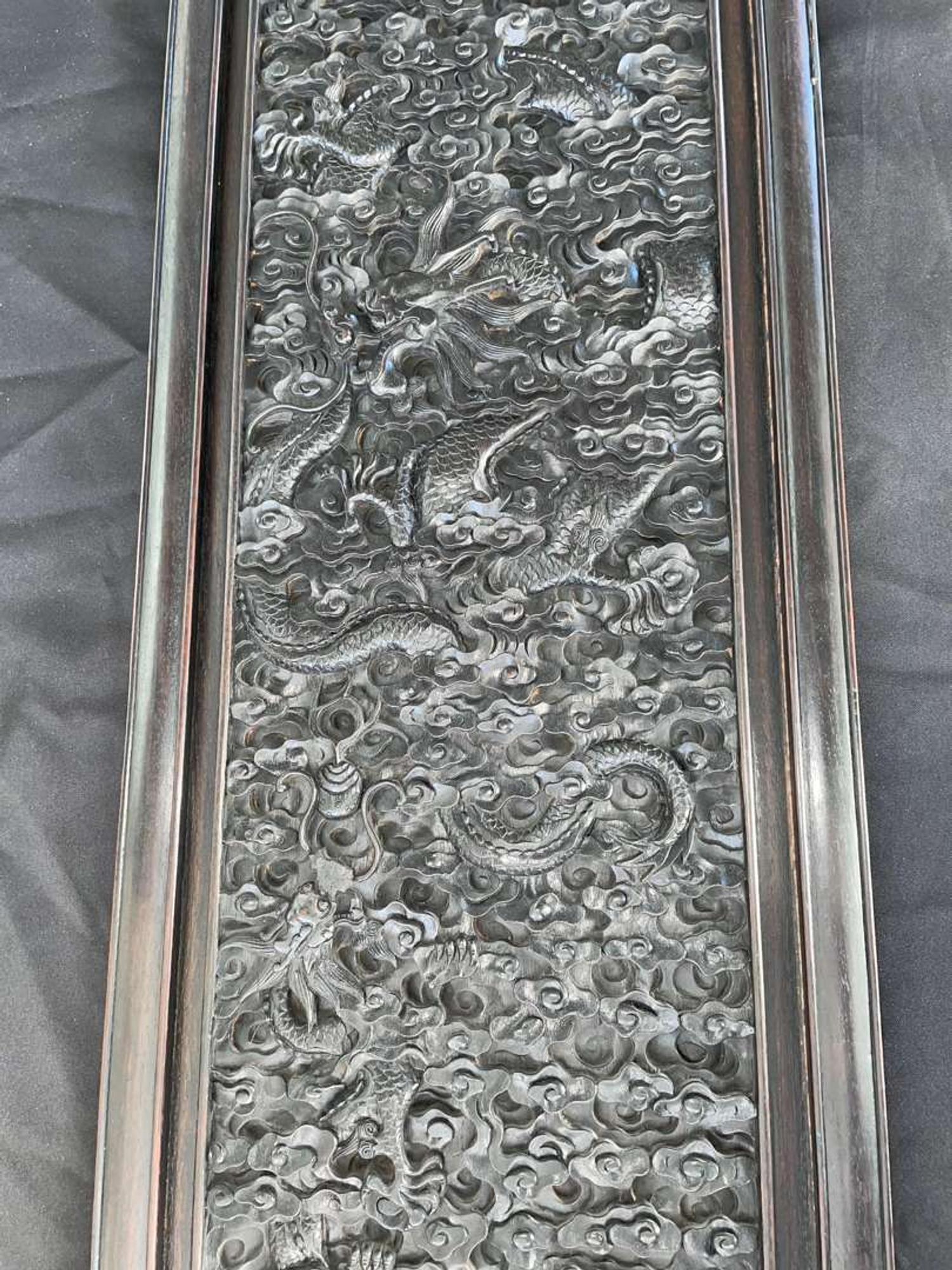 A Chinese carved hardwood six-panel “Dragons” screen 硬木浮雕龙纹六开屏风