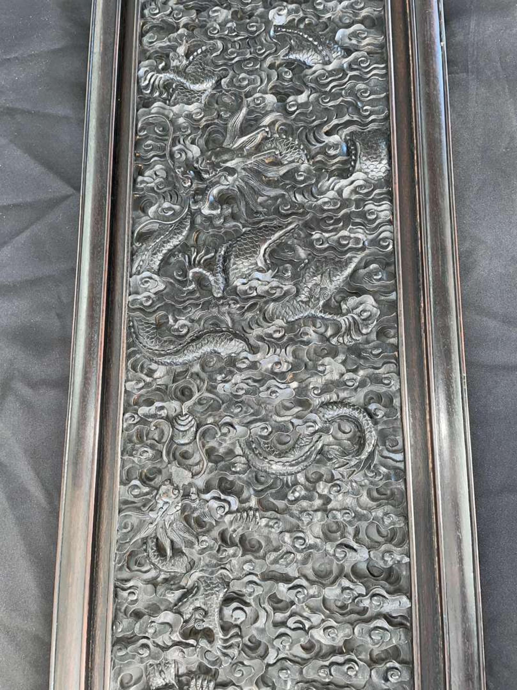 A Chinese carved hardwood six-panel “Dragons” screen 硬木浮雕龙纹六开屏风