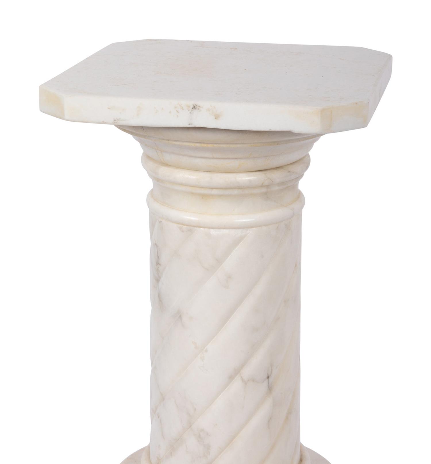 A Pair of Continental Carved Marble Pedestals