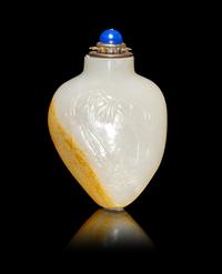 A Chinese Russet and White Jade 'Fishing' Snuff Bottle
