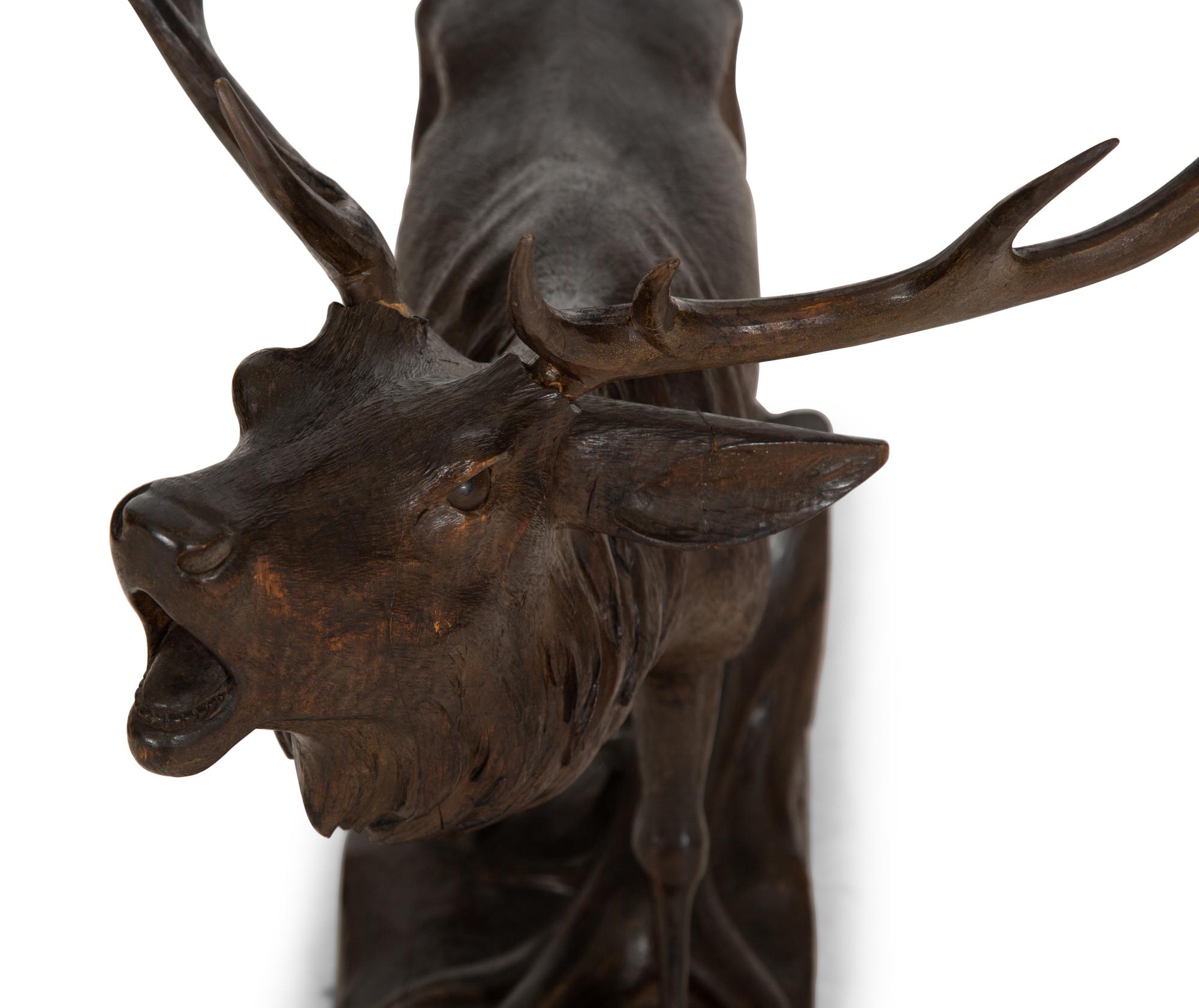 A Swiss Black Forest Carved Walnut Figure of an Elk