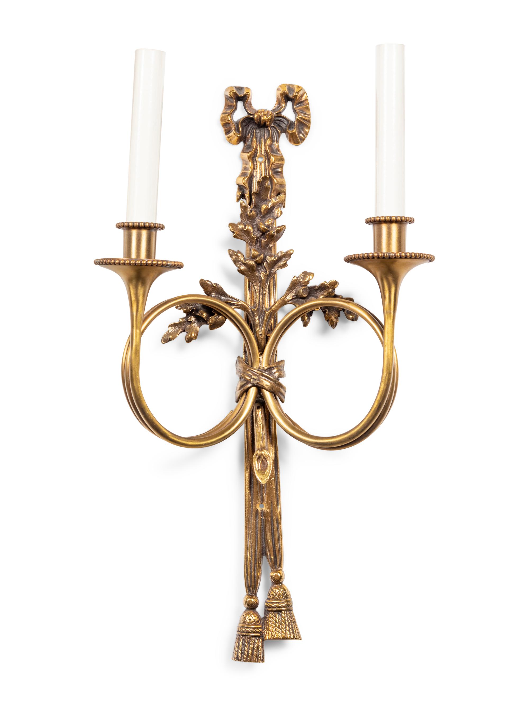A Set of Seven Louis XVI Style Brass Two-Light Sconces