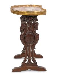 A Diminuitive Continental Carved Mahogany Side Table
