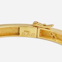 An 18K Yellow Gold and Diamond Bangle