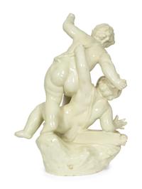 A Continental White-Glazed Faience Putti Group