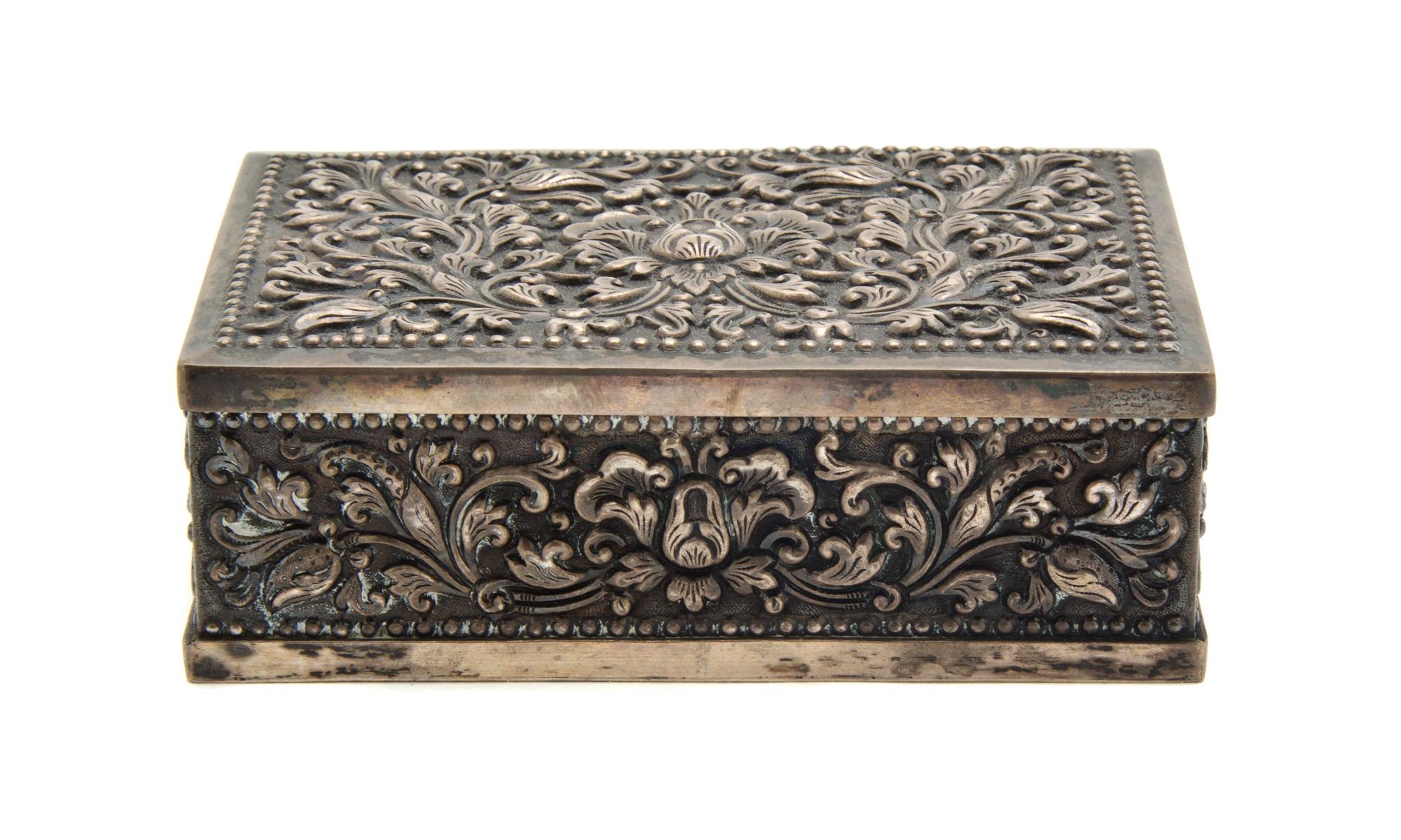 A Continental Silver Mounted Cigarette Box, Width 5 inches.