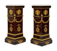 A Pair of Monumental Empire Style Gilt Bronze Mounted Mahogany Pedestals