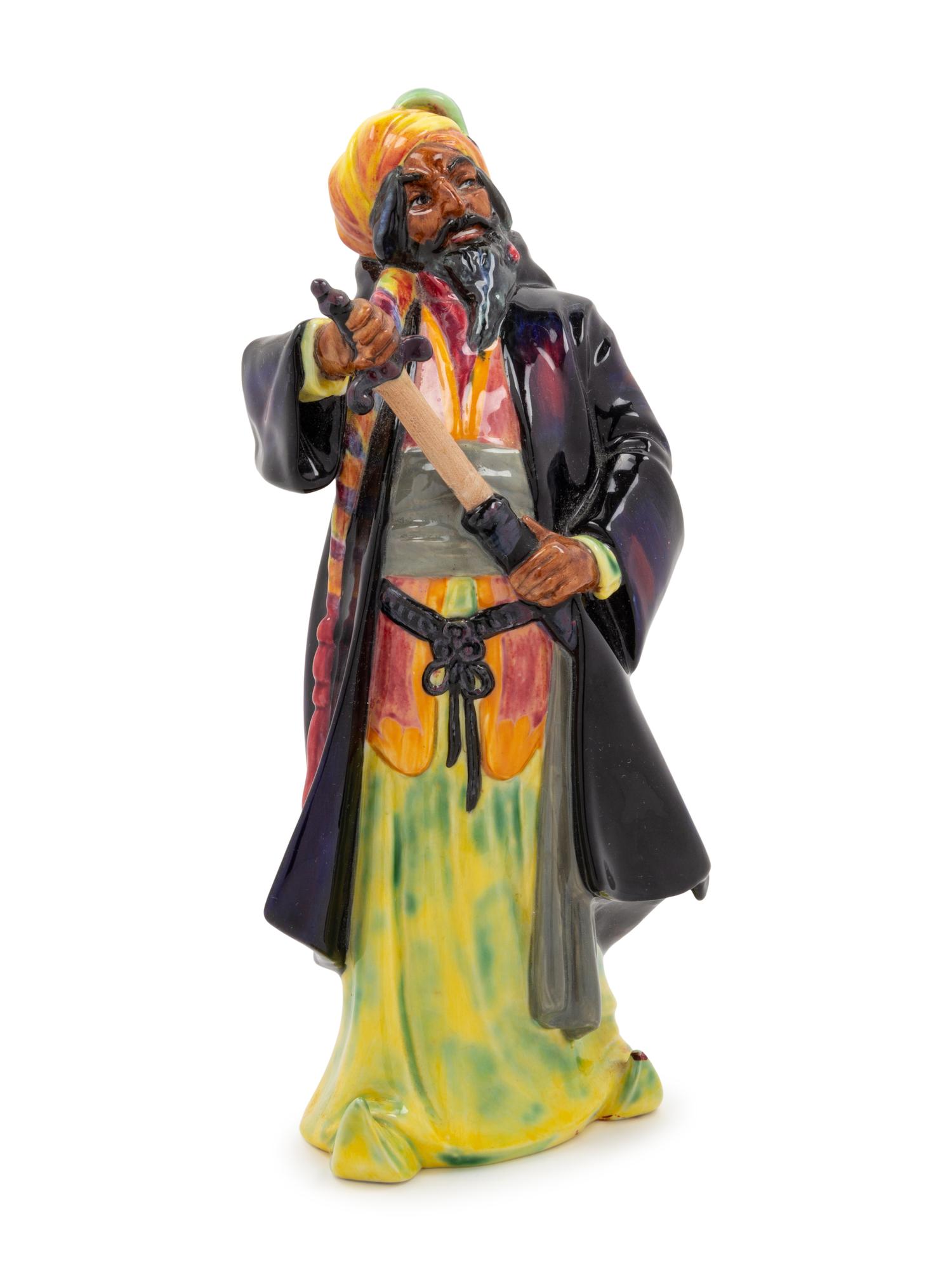 A Royal Doulton Figurine of Blue Beard and an Associated Ceramic Figurine