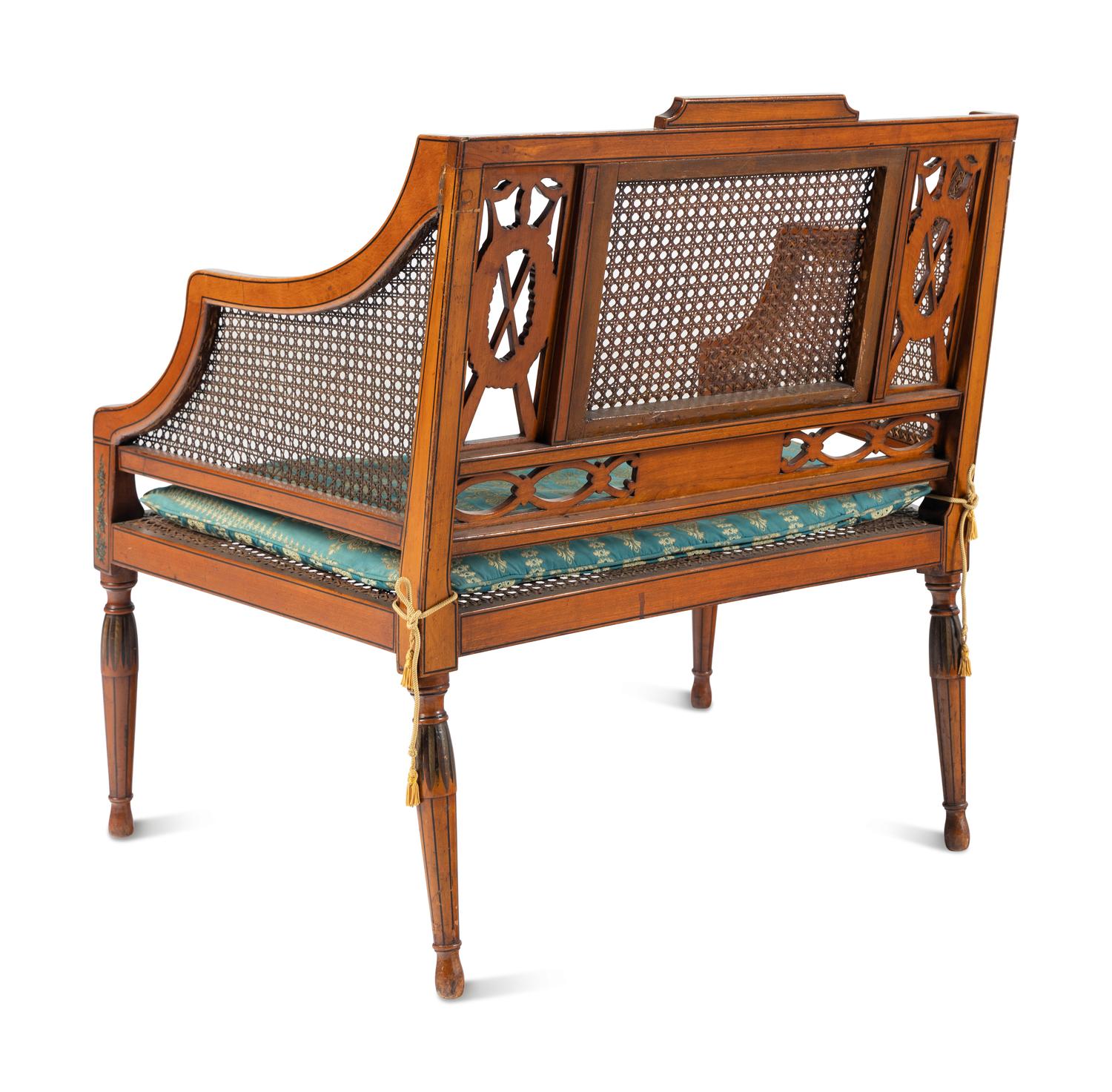 An Edwardian Painted and Caned Armchair