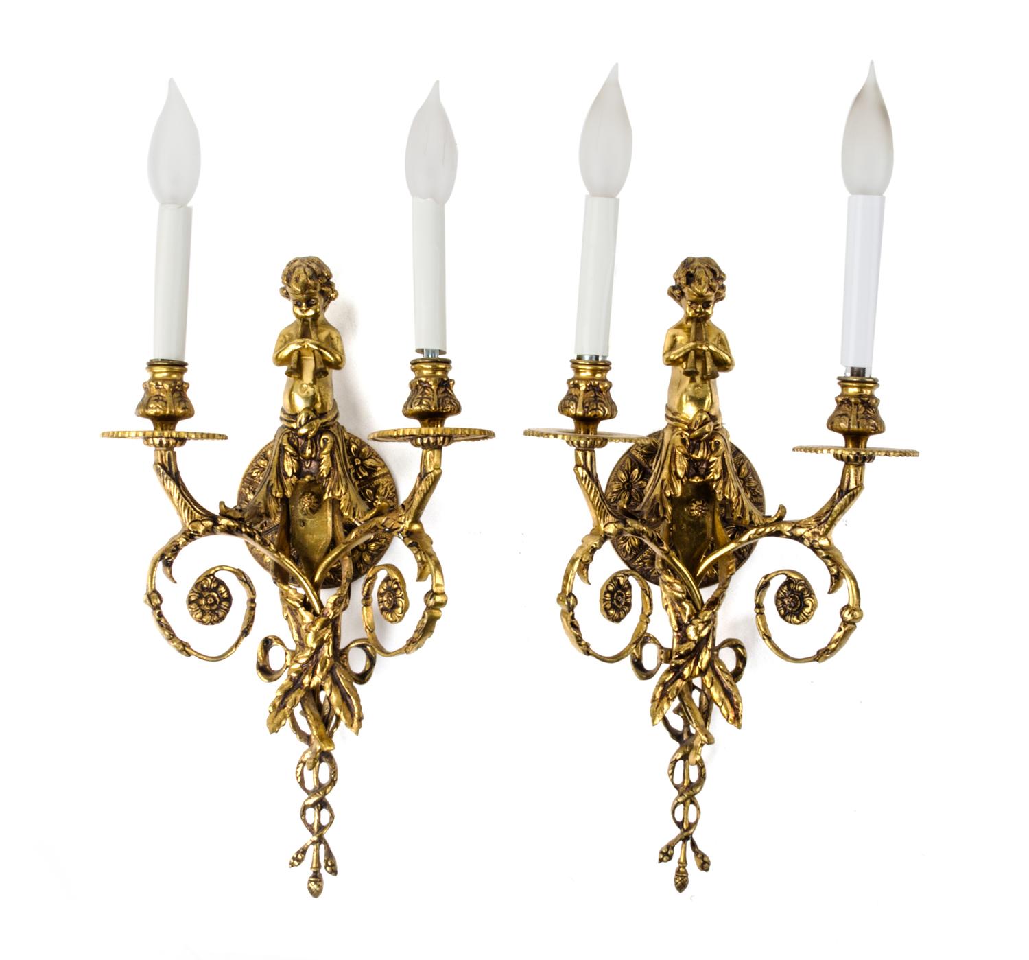 A Pair of Neoclassical Brass Two-Light Figural Sconces Height 21 inches. — 20TH CENTURY