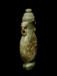 A Carved Spinach Green Jade Ring-Handled Vase and Cover