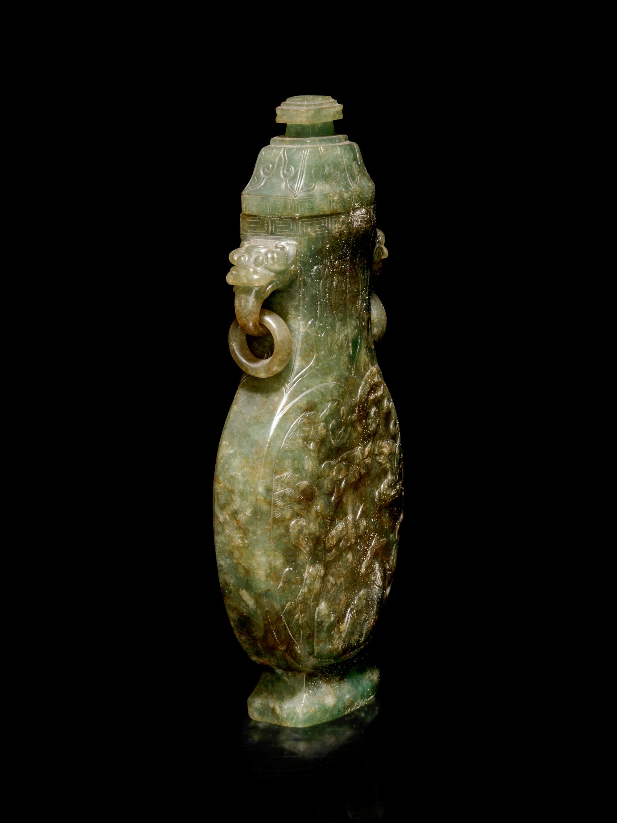 A Carved Spinach Green Jade Ring-Handled Vase and Cover
