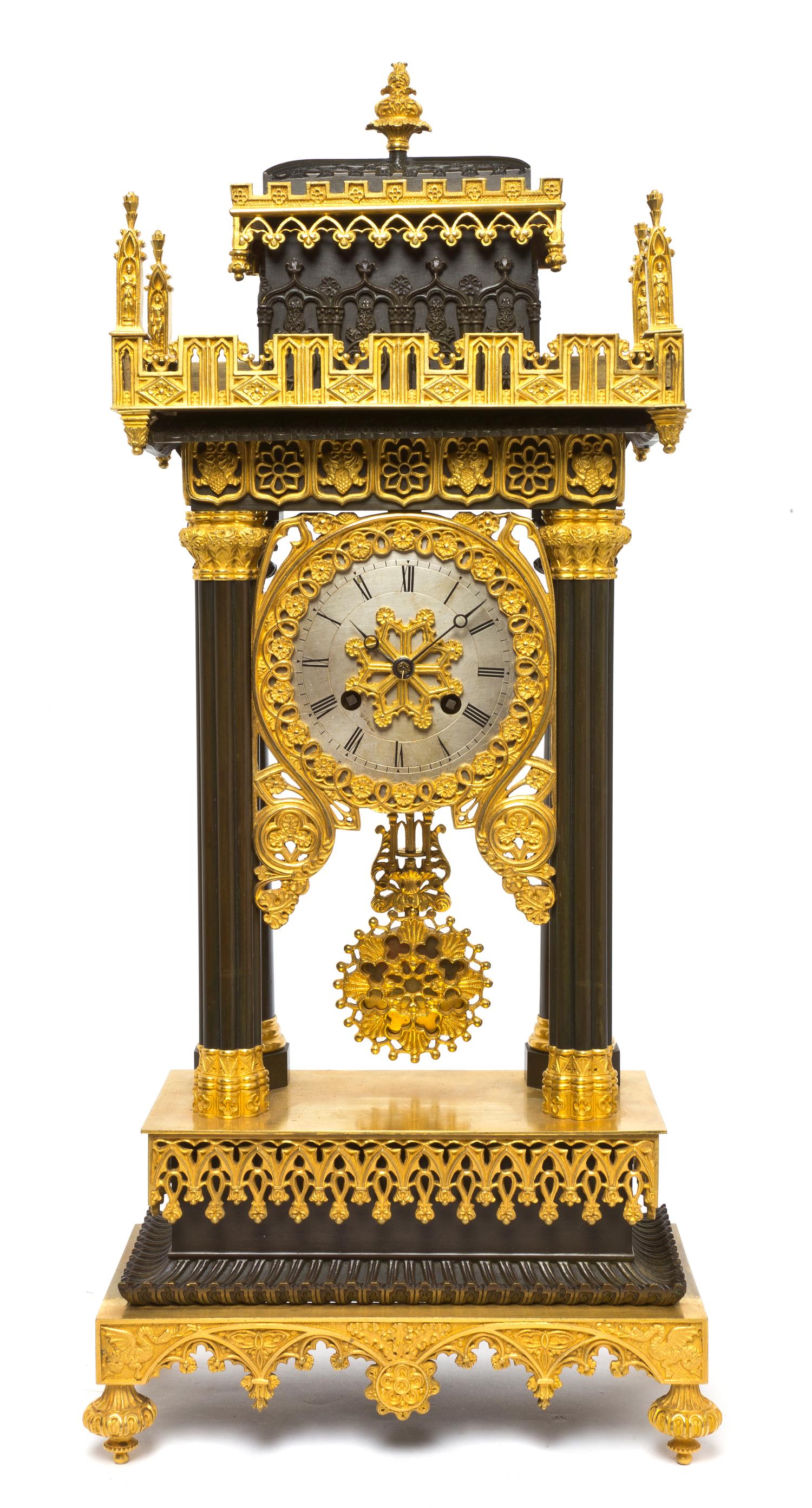 A Gothic Revival Gilt and Patinated Bronze Portico Clock, Height 21 1/4 inches.