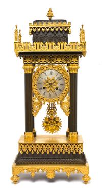 A Gothic Revival Gilt and Patinated Bronze Portico Clock, Height 21 1/4 inches.
