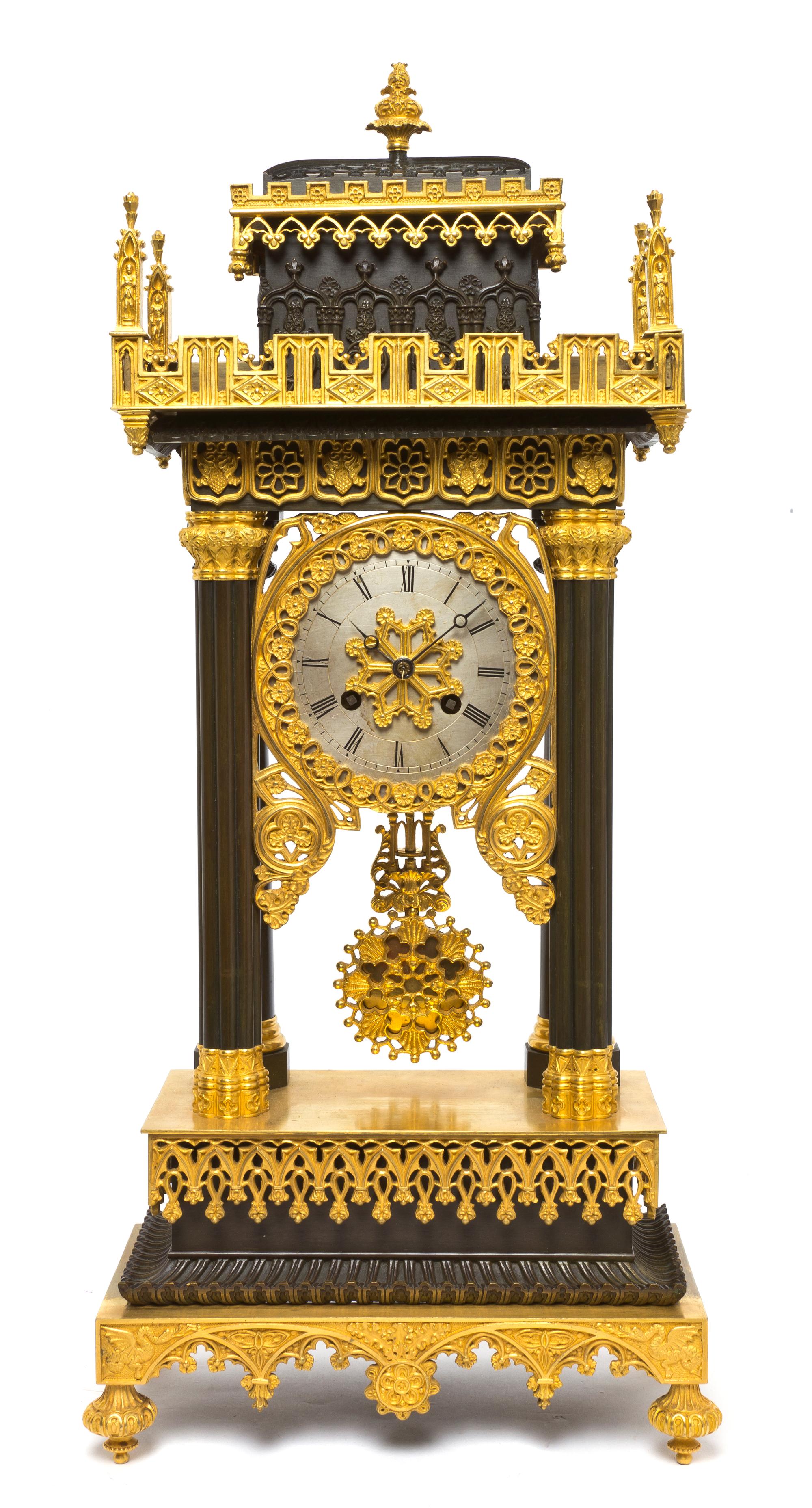 A Gothic Revival Gilt and Patinated Bronze Portico Clock, Height 21 1/4 inches.