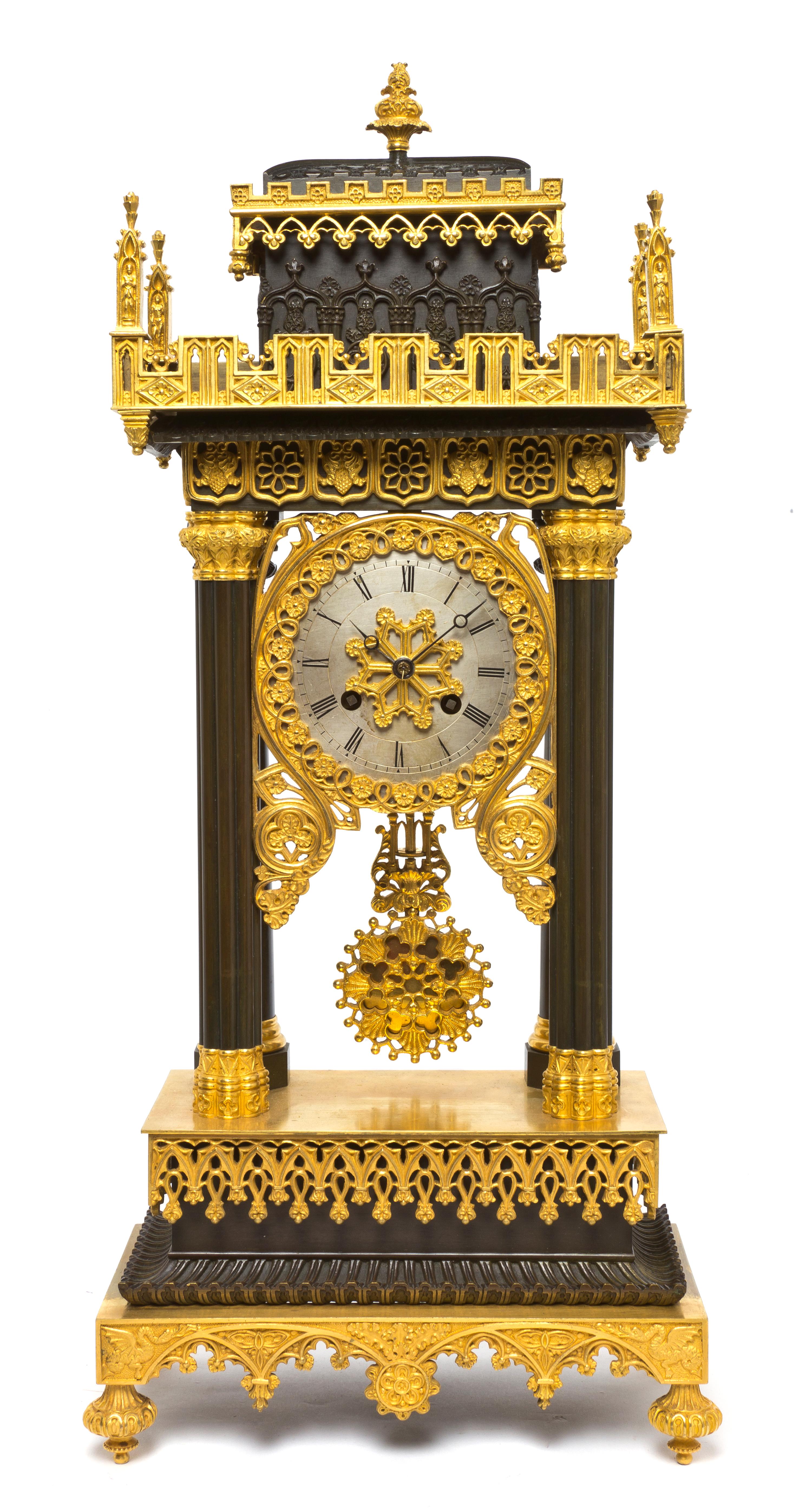 A Gothic Revival Gilt and Patinated Bronze Portico Clock, Height 21 1/4 inches.