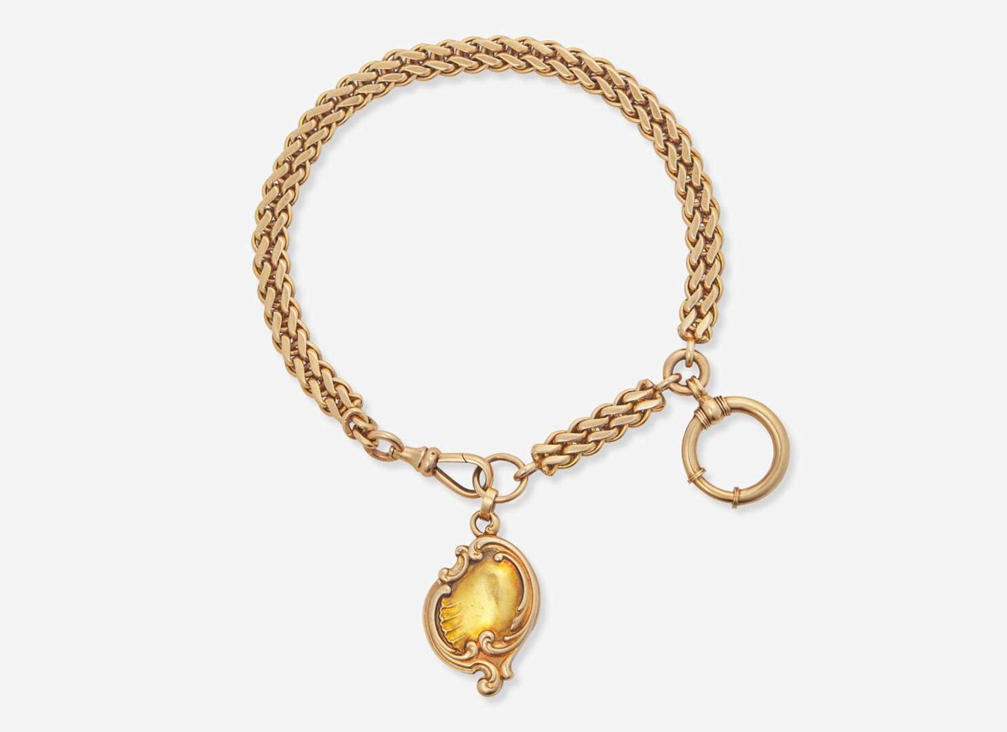 A 14K Yellow Gold Russian Pocket Watch Chain and Locket