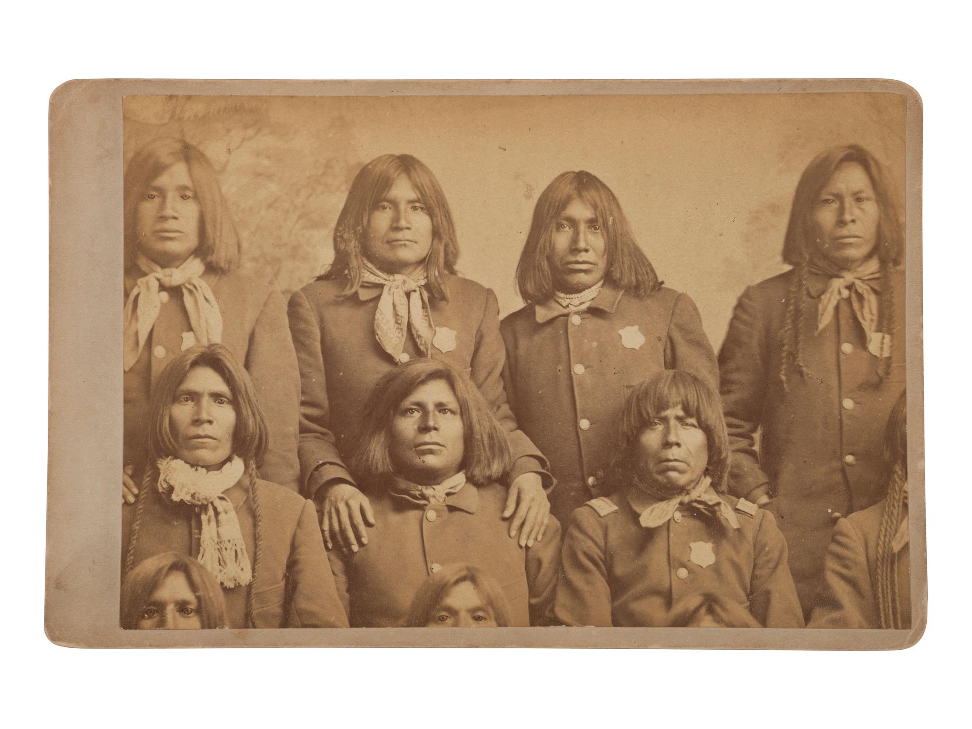 [NATIVE AMERICANS]. BUEHMAN & HARTWELL, photographers. Cabinet card of Pima tribal police. Tucson, Arizona Territory. Ca 1870s-80s.