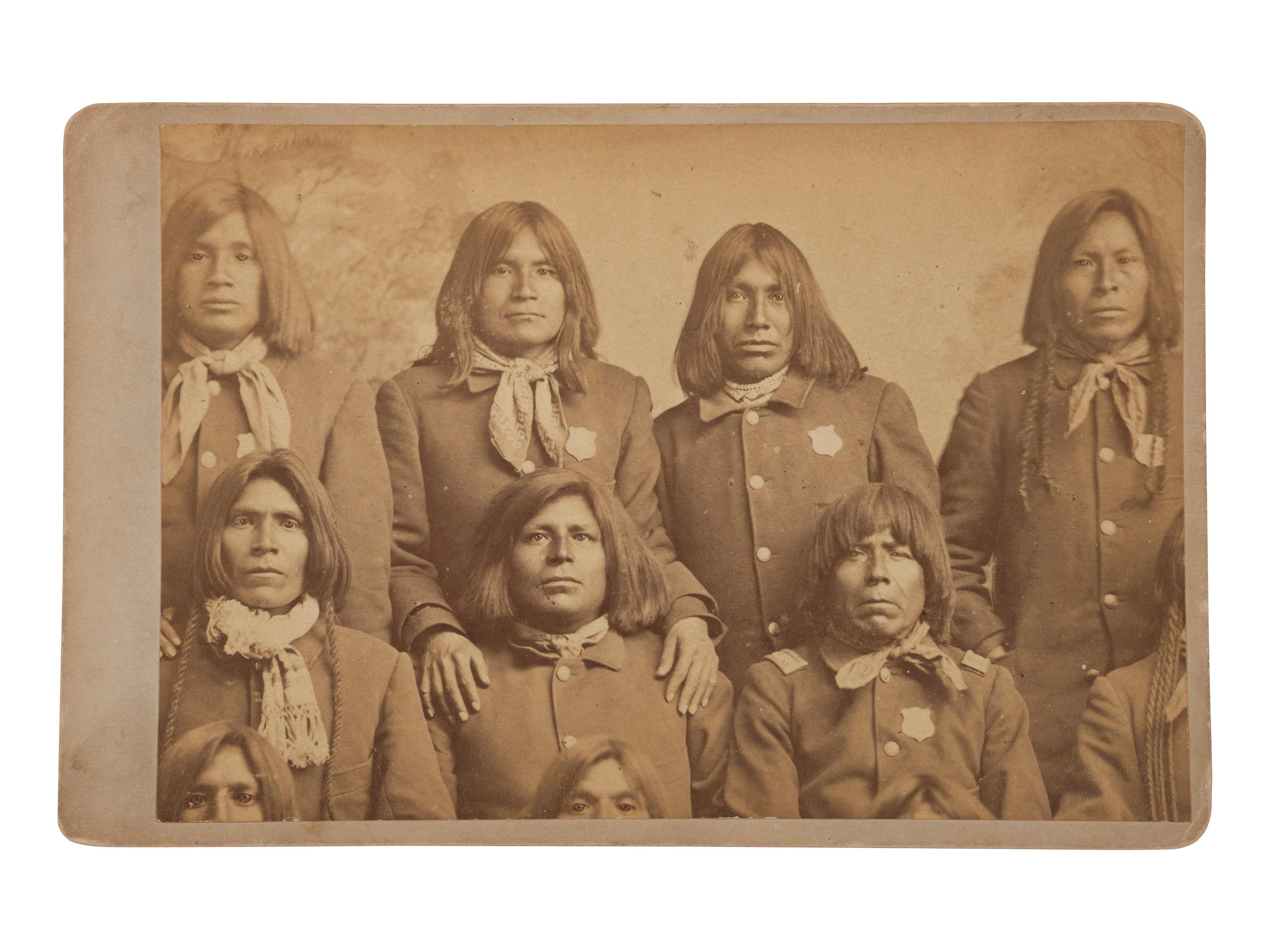 [NATIVE AMERICANS]. BUEHMAN & HARTWELL, photographers. Cabinet card of Pima tribal police. Tucson, Arizona Territory. Ca 1870s-80s.